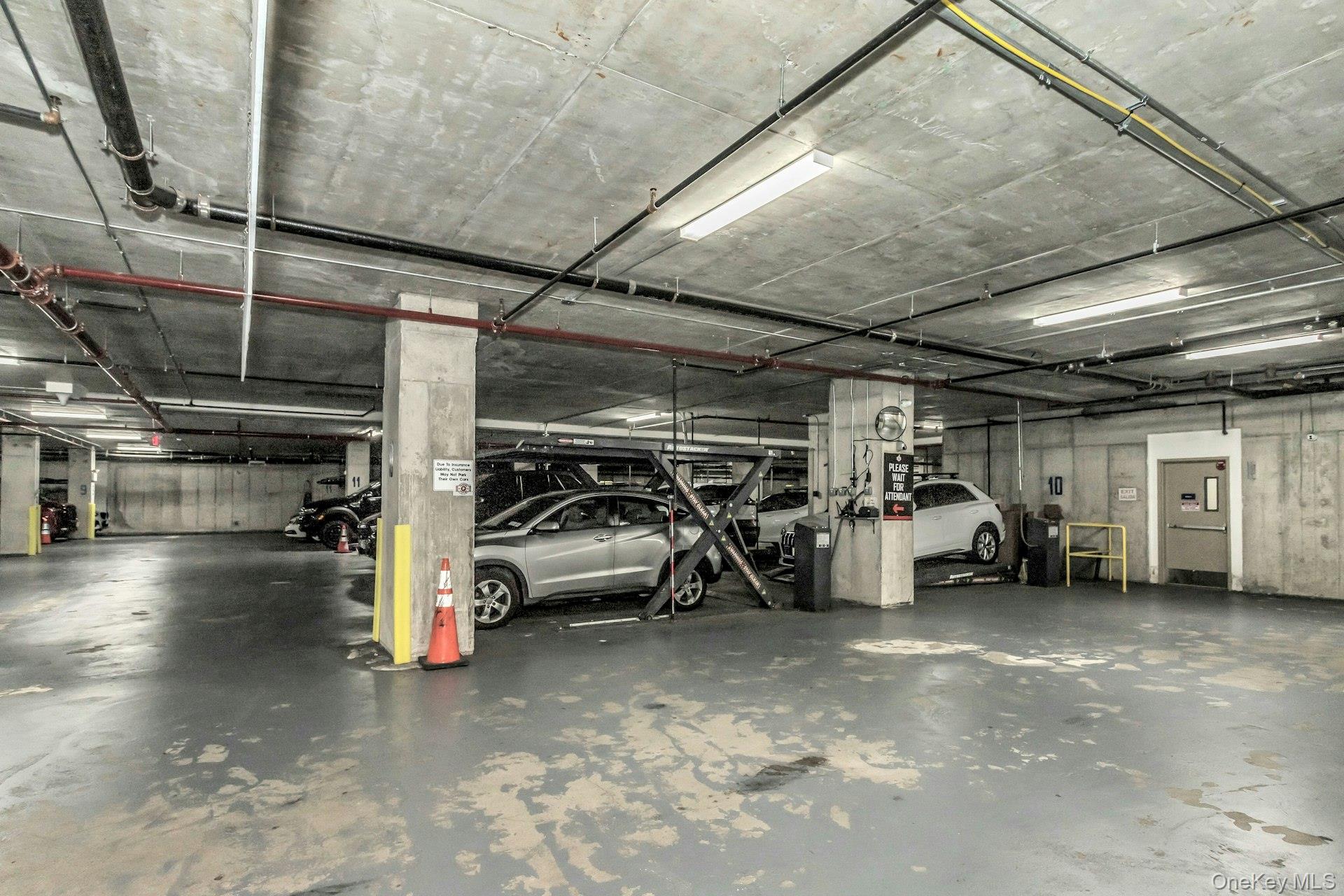88-08 Justice Avenue, Unit 15N Queens, NY 11373 - Photo 17 of 20 a view of parking garage with cars