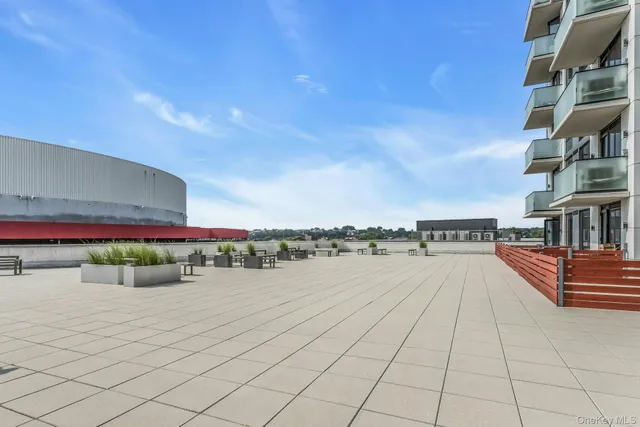 a view of terrace with seating space and city view