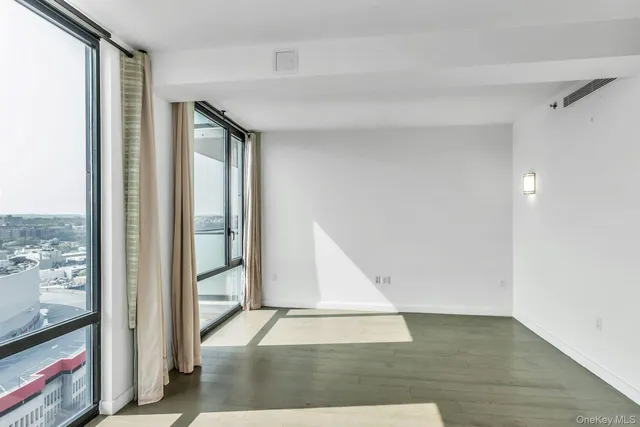 a view of an entryway with wooden floor