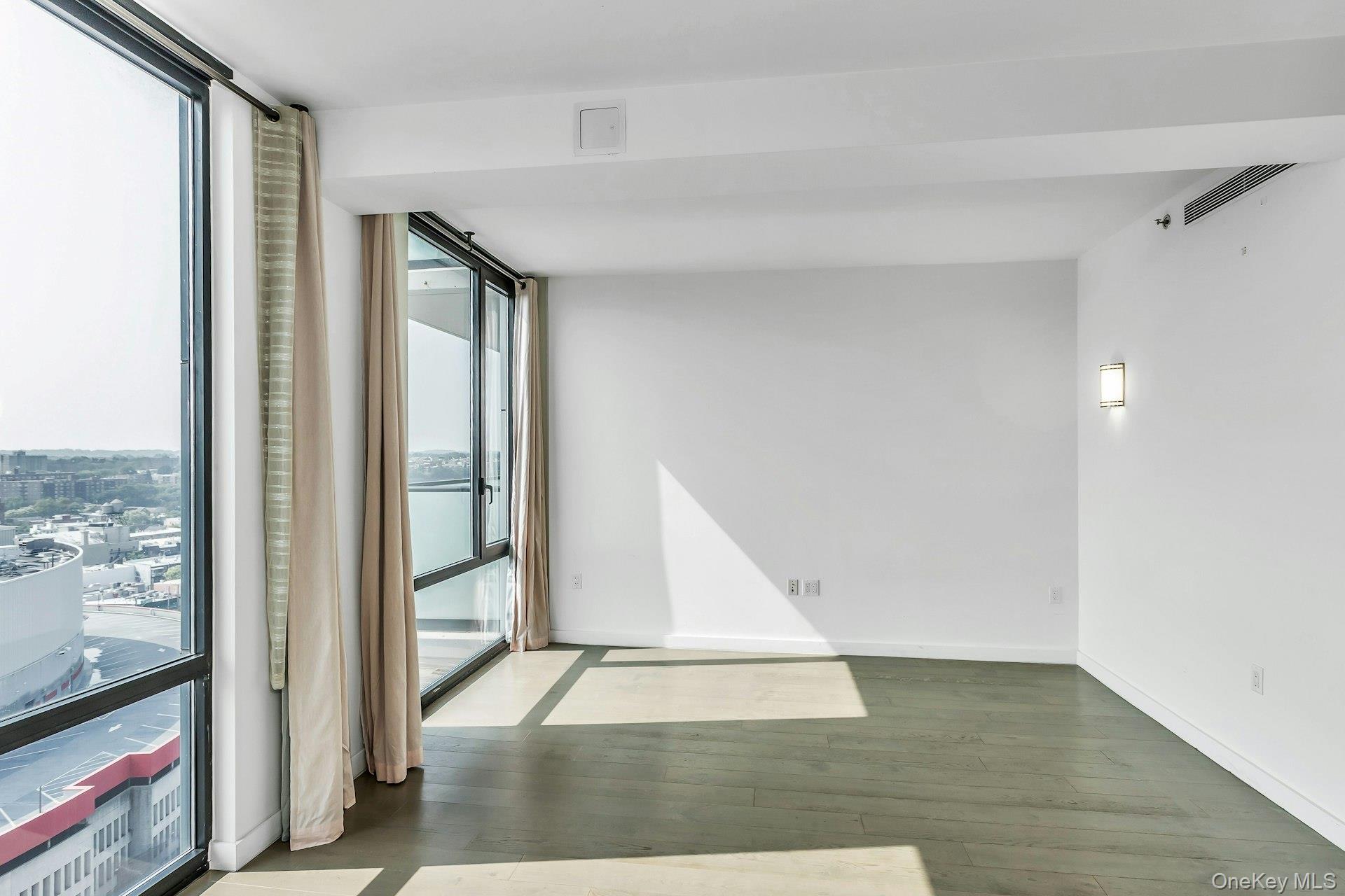 88-08 Justice Avenue, Unit 15N Queens, NY 11373 - Photo 3 of 20 a view of an entryway with wooden floor