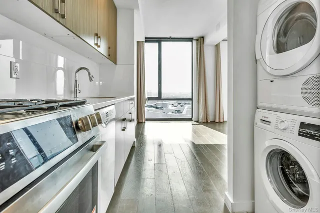 a view of a kitchen with washer and dryer
