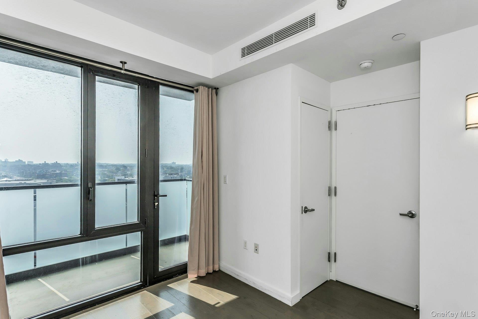 88-08 Justice Avenue, Unit 15N Queens, NY 11373 - Photo 9 of 20 a view of a bathroom with a glass door