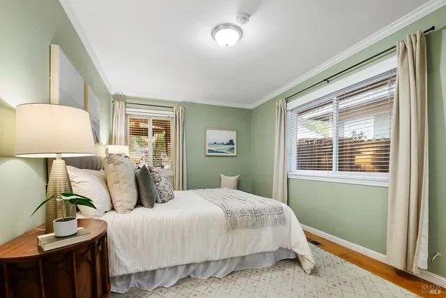 a bedroom with a large bed and a window