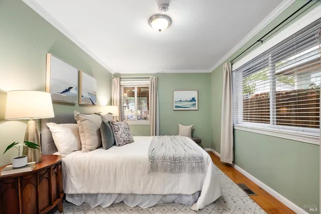 a bedroom with a bed and a night stand