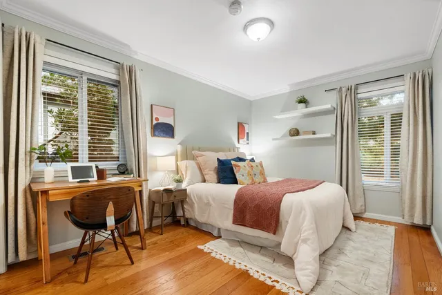 a bedroom with a bed and a chair