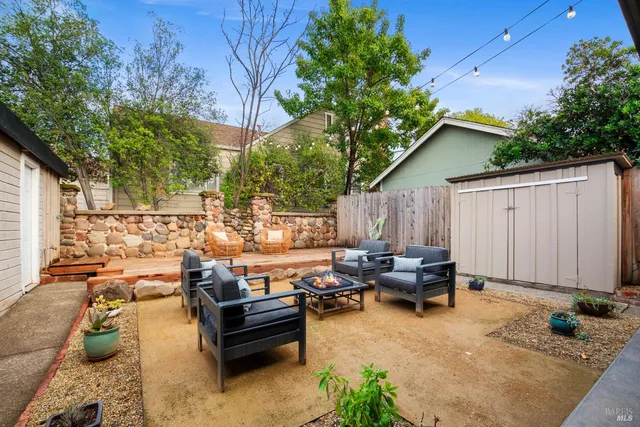 a view of a patio with couches and potted plants