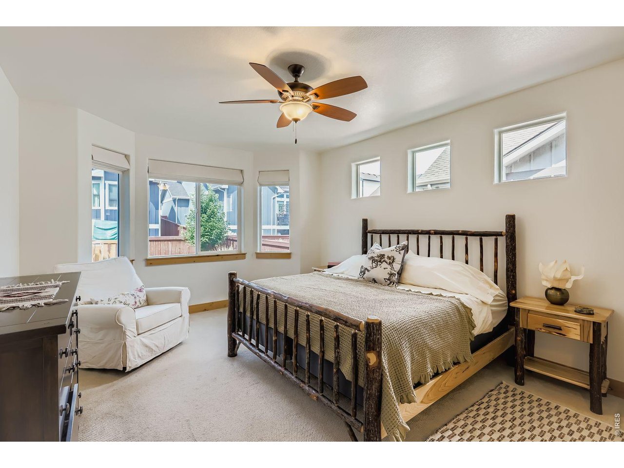 2012 Day Spring Drive Windsor, CO 80550 - Photo 12 of 31 Extended bay windows fill this bedroom with natural light and inviting warmth all day long.