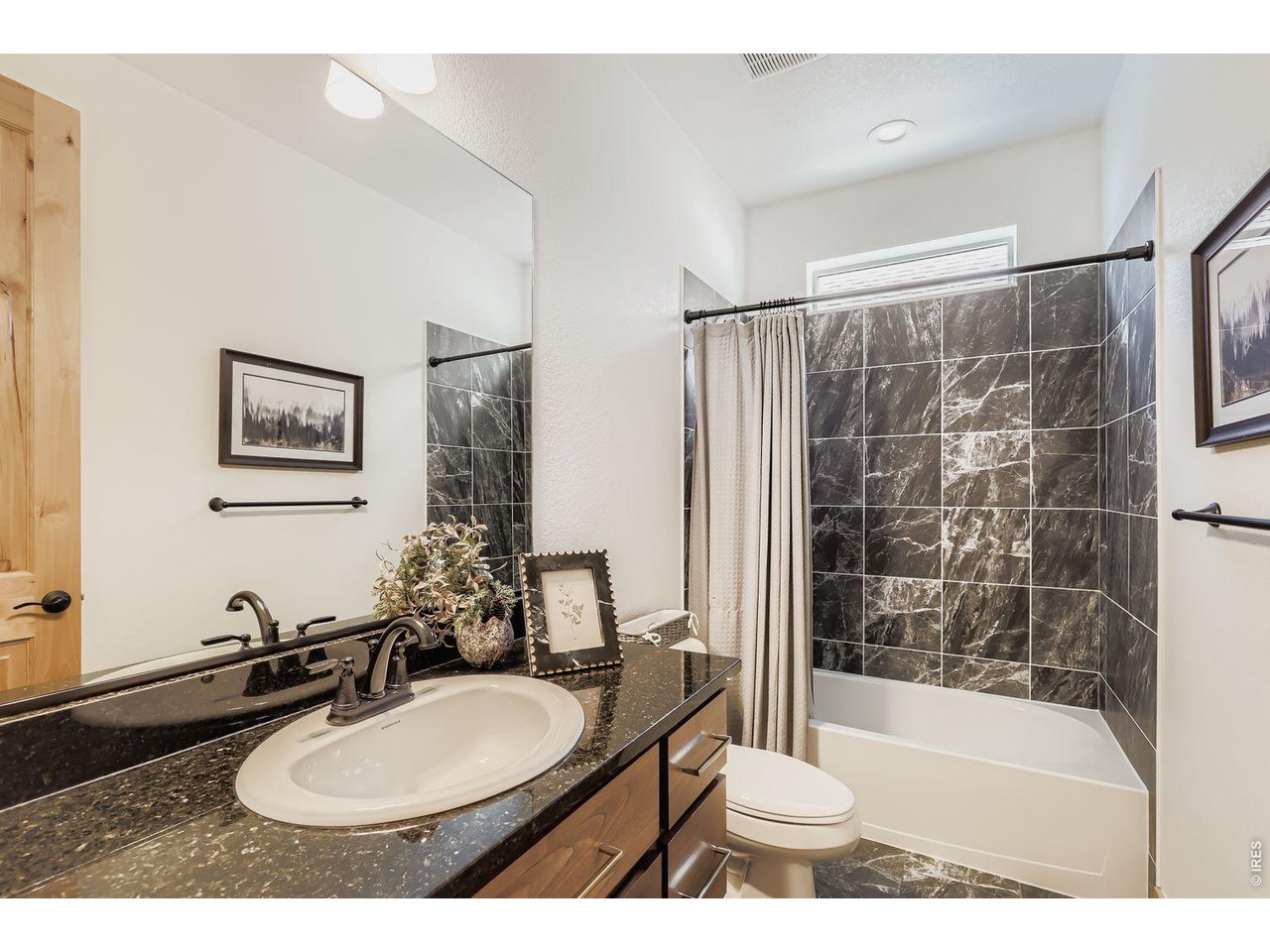 2012 Day Spring Drive Windsor, CO 80550 - Photo 17 of 31 Sophisticated custom tiling in the 2nd full bath on main level.