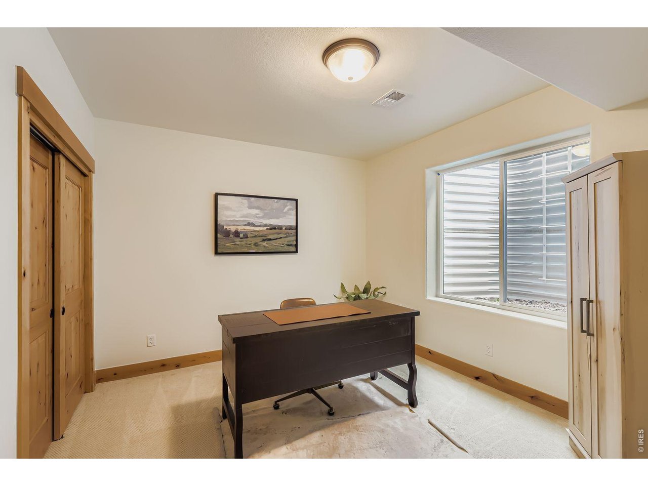 2012 Day Spring Drive Windsor, CO 80550 - Photo 22 of 31 Quiet and bright lower-level guest suite/office space with natural wood accents and large egress window.