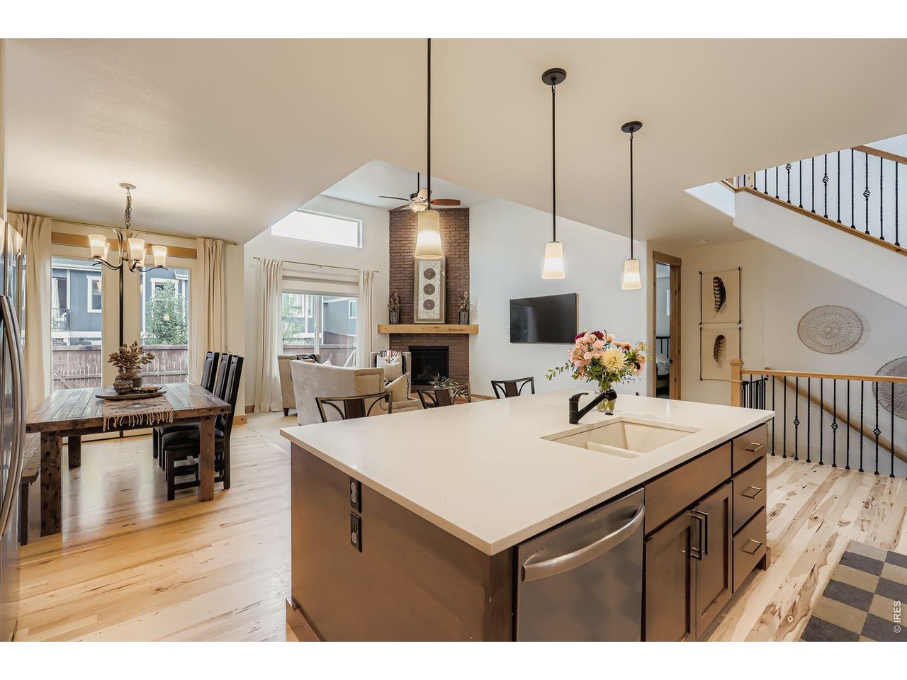 2012 Day Spring Drive Windsor, CO 80550 - Photo 10 of 31 Seamlessly connected kitchen, dining, and living spaces.