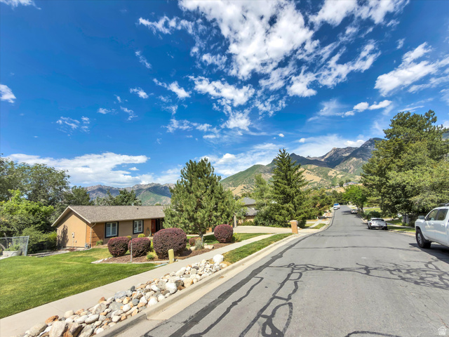 2863 Fallentine Road Sandy, UT 84093 - Photo 3 of 48 Single-story residence with a light brown exterior and dark trim