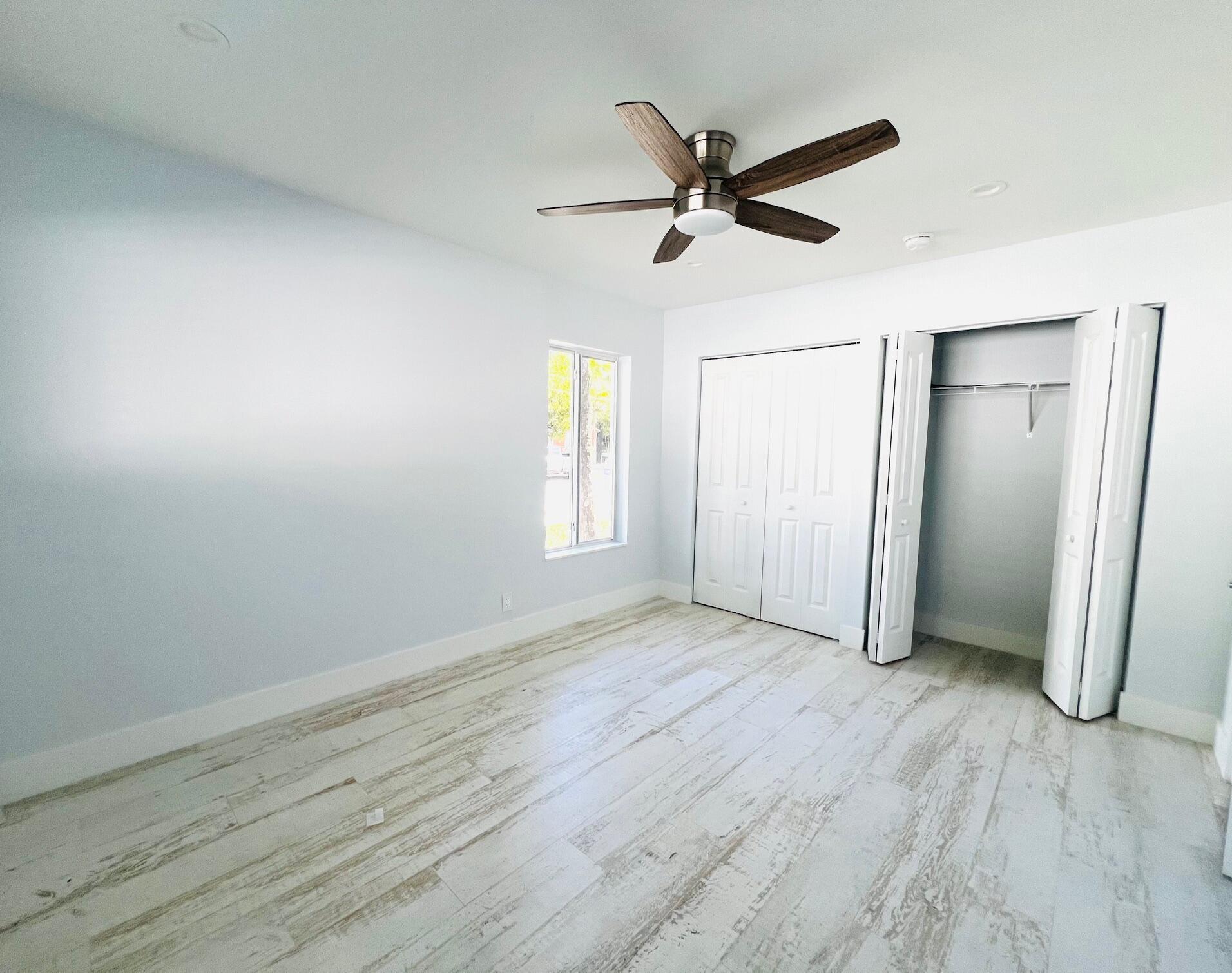 206 Southeast 1st Avenue, Unit 5 Delray Beach, FL 33444 - Photo 6 of 8 wooden floor in an empty room