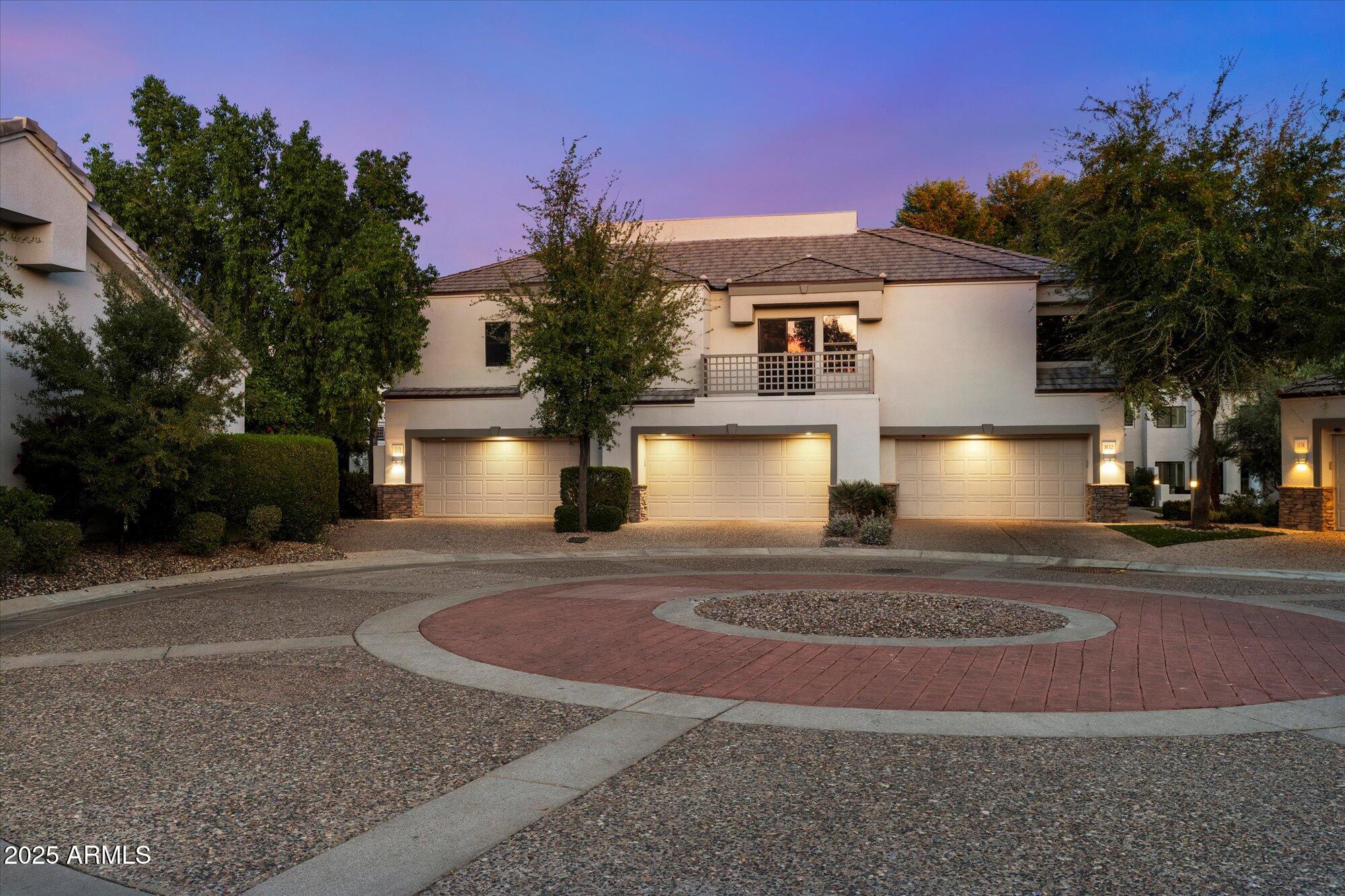 a front view of a house with yard