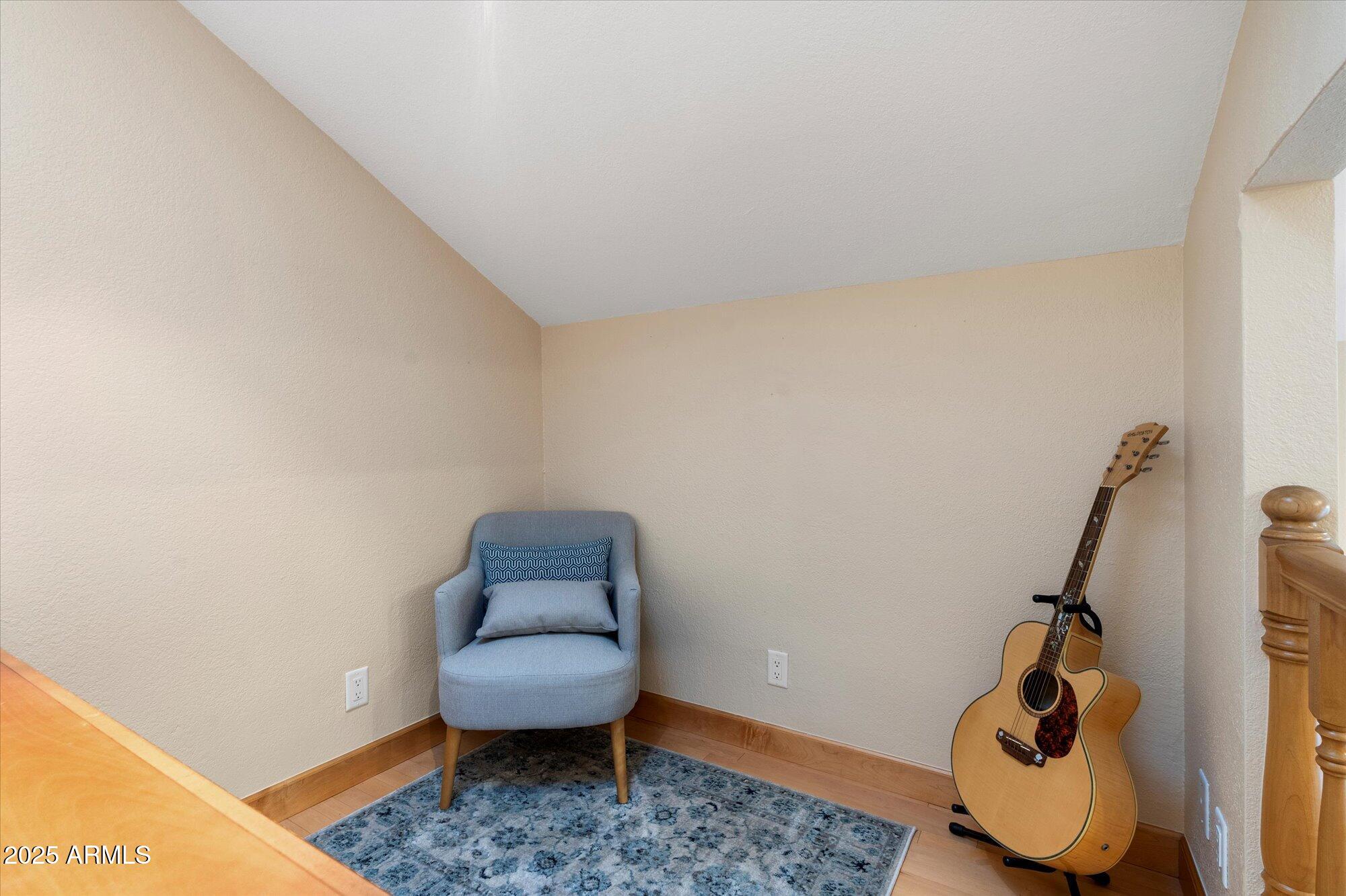 7272 East Gainey Ranch Road, Unit 104 Scottsdale, AZ 85258 - Photo 12 of 45 a living room with furniture and a rug