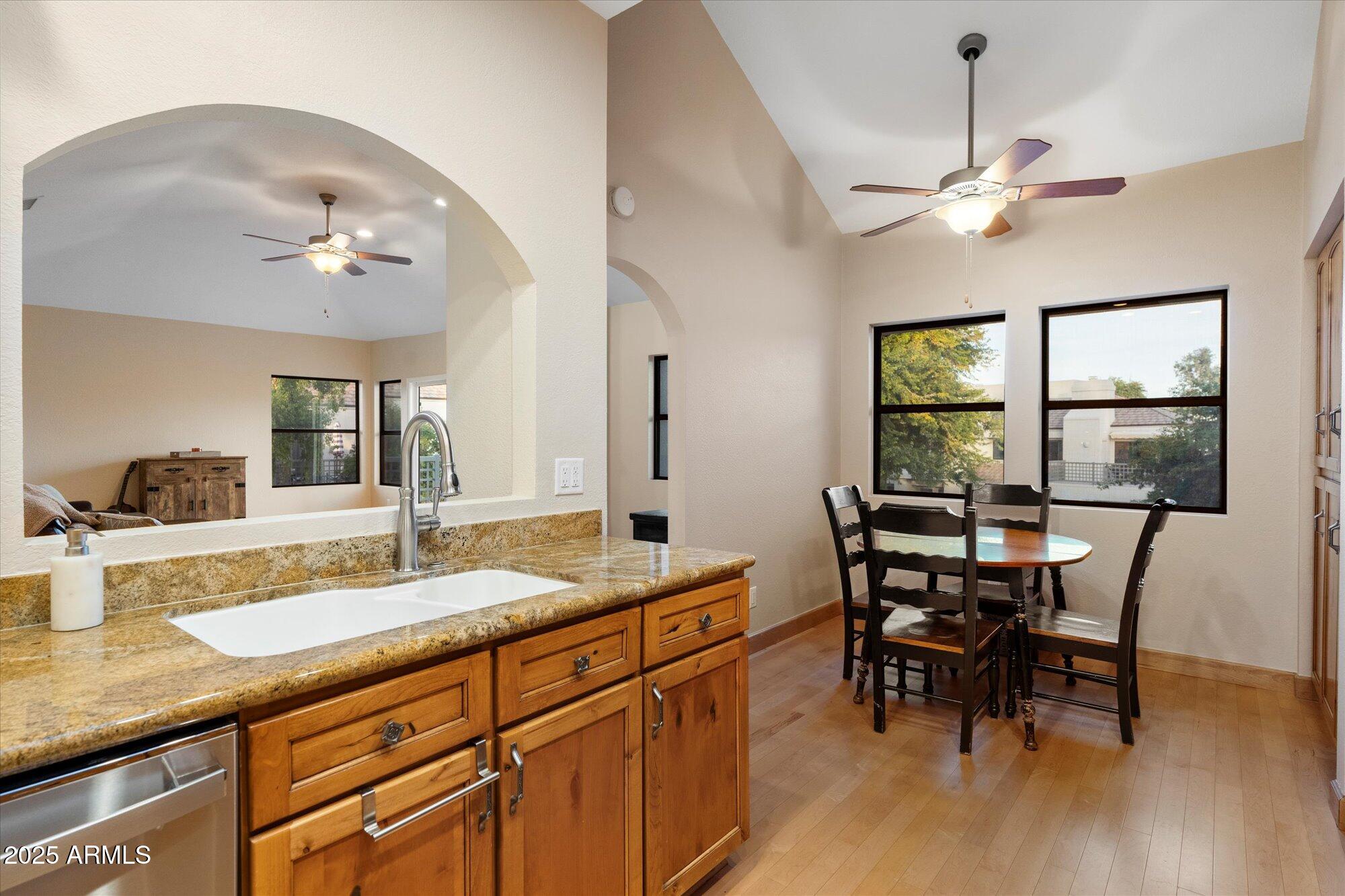 7272 East Gainey Ranch Road, Unit 104 Scottsdale, AZ 85258 - Photo 17 of 45 a dining room with furniture and window