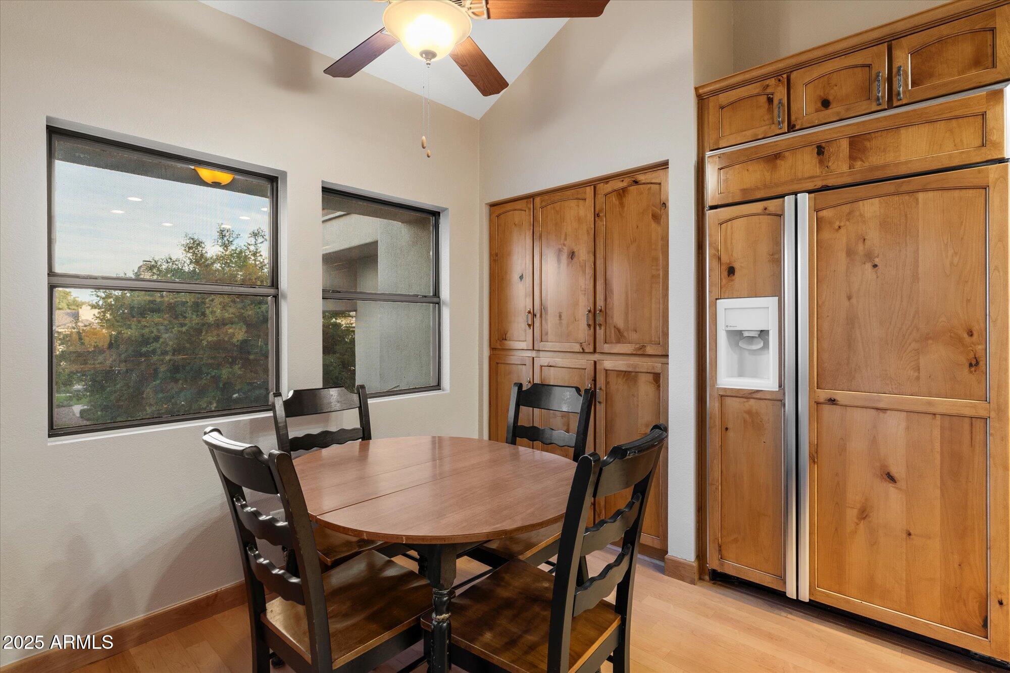 7272 East Gainey Ranch Road, Unit 104 Scottsdale, AZ 85258 - Photo 18 of 45 a view of a dining room with furniture window and outside view