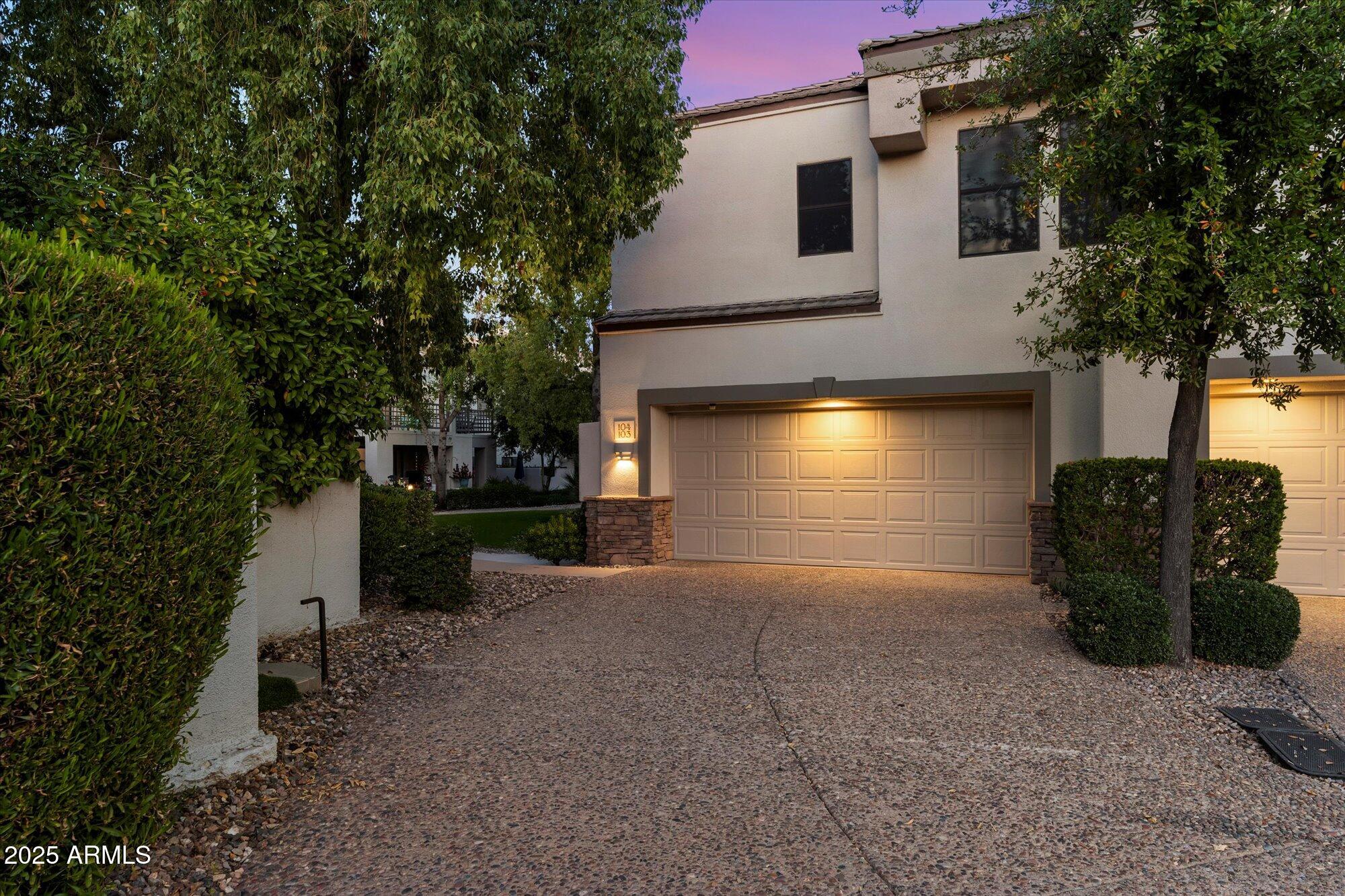 7272 East Gainey Ranch Road, Unit 104 Scottsdale, AZ 85258 - Photo 2 of 45 a view of a house with a yard