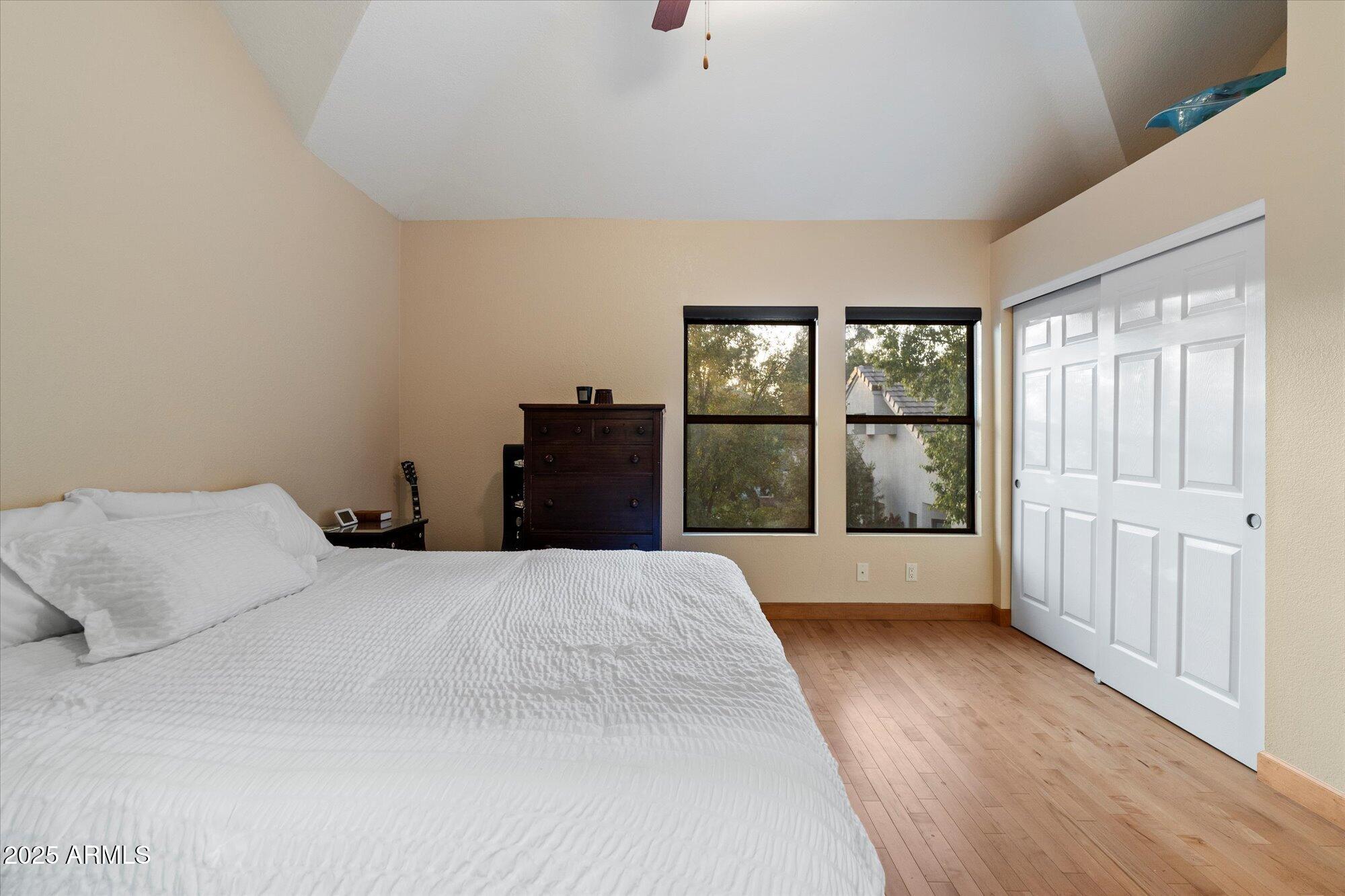 7272 East Gainey Ranch Road, Unit 104 Scottsdale, AZ 85258 - Photo 21 of 45 a bedroom with a bed and a window
