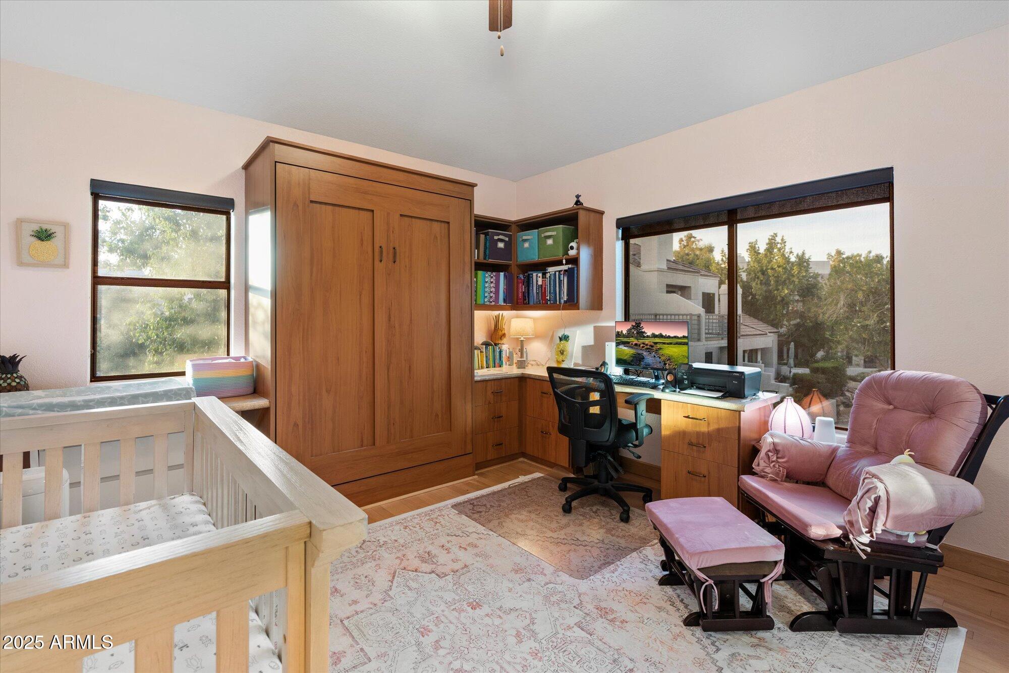 7272 East Gainey Ranch Road, Unit 104 Scottsdale, AZ 85258 - Photo 29 of 45 a living room with furniture and a large window