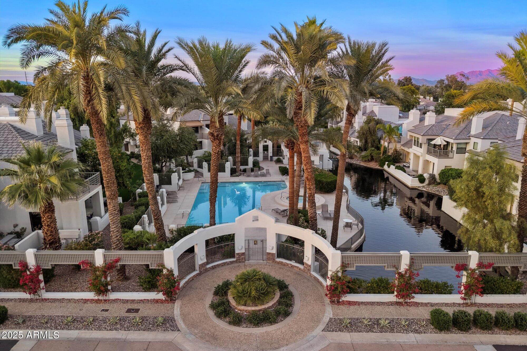 7272 East Gainey Ranch Road, Unit 104 Scottsdale, AZ 85258 - Photo 3 of 45 a view of multiple house with outdoor space