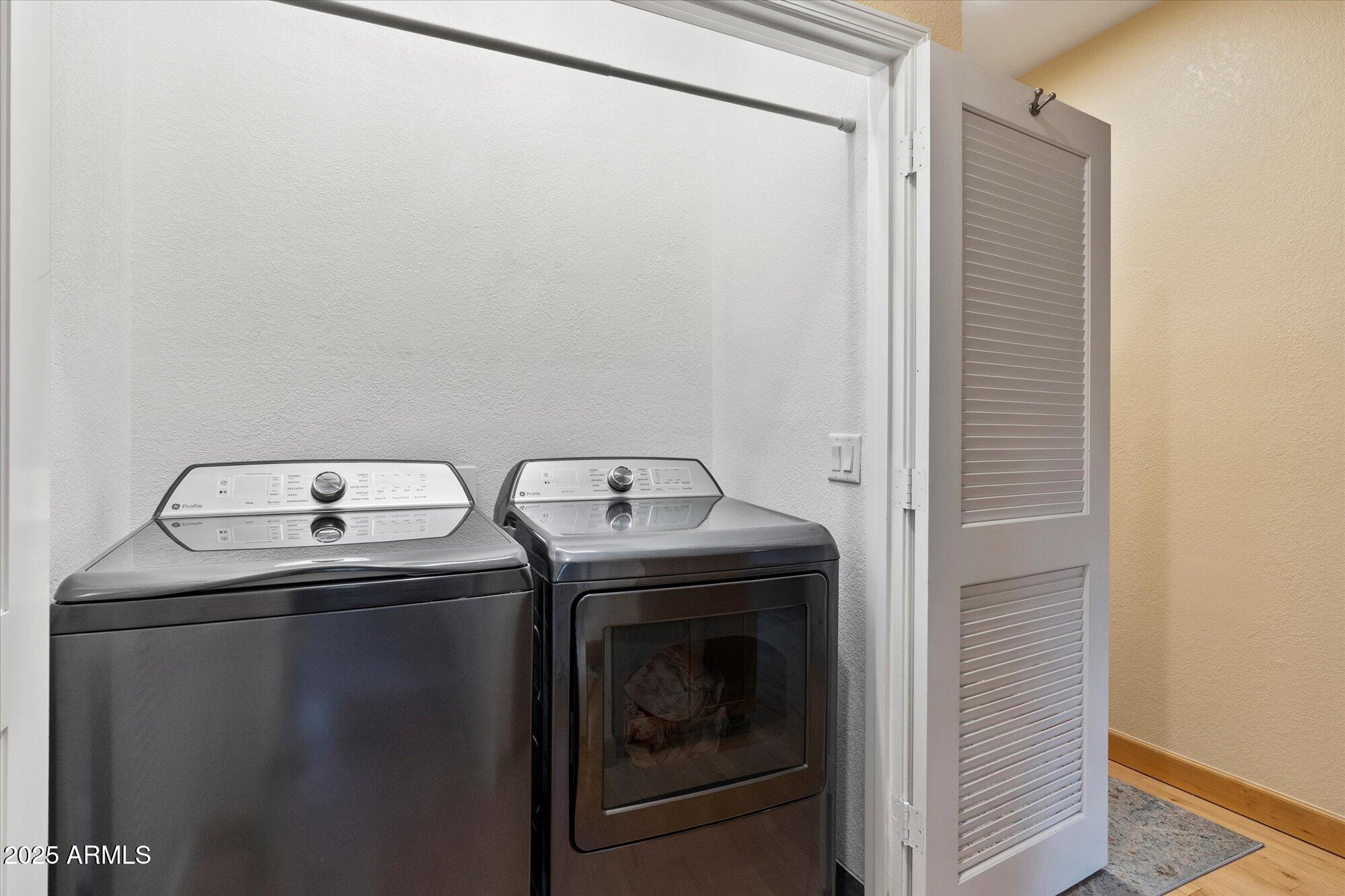 7272 East Gainey Ranch Road, Unit 104 Scottsdale, AZ 85258 - Photo 32 of 45 a utility room with dryer and washer