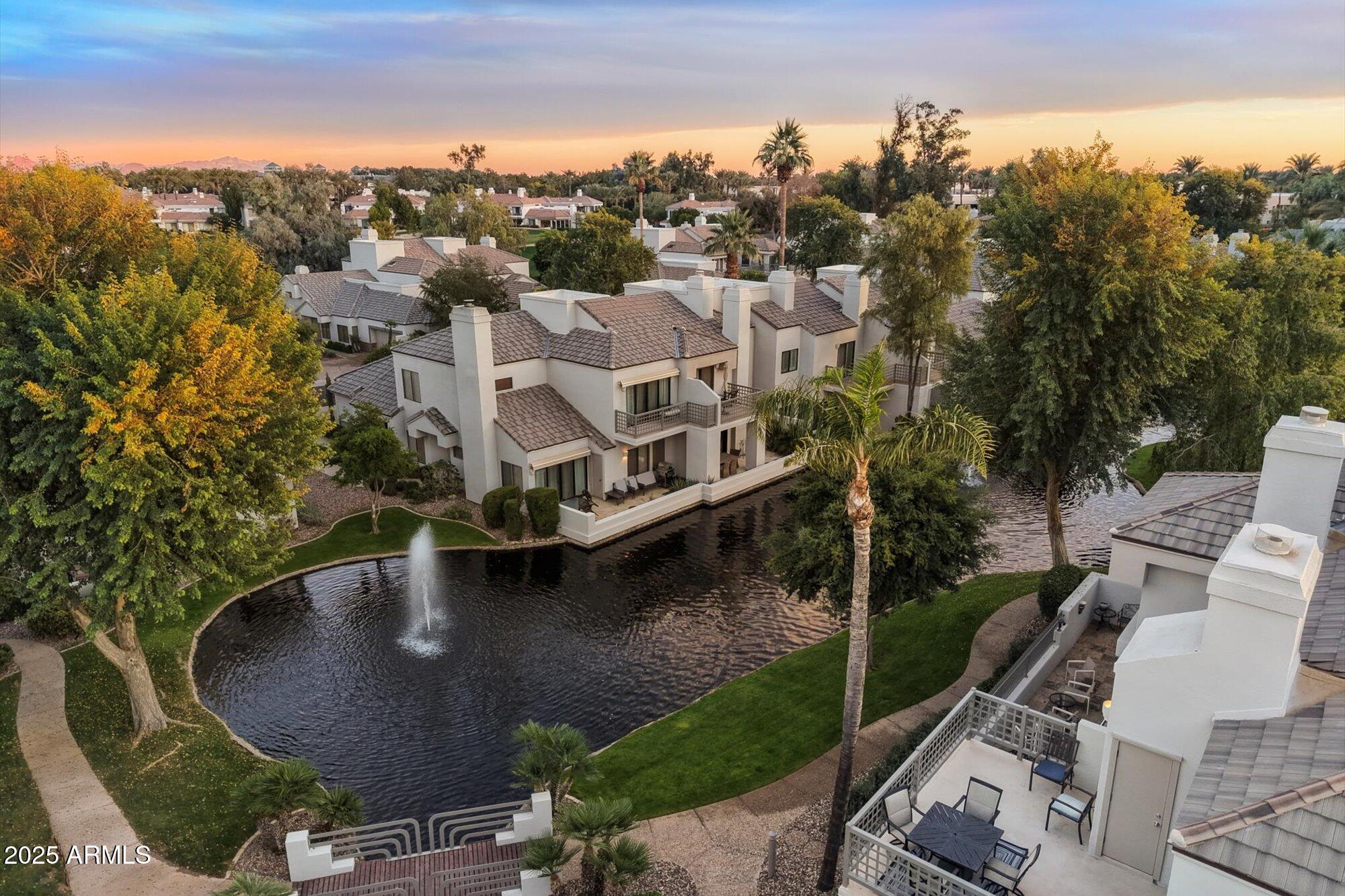 7272 East Gainey Ranch Road, Unit 104 Scottsdale, AZ 85258 - Photo 34 of 45 an aerial view of a house with outdoor space swimming pool and mountains