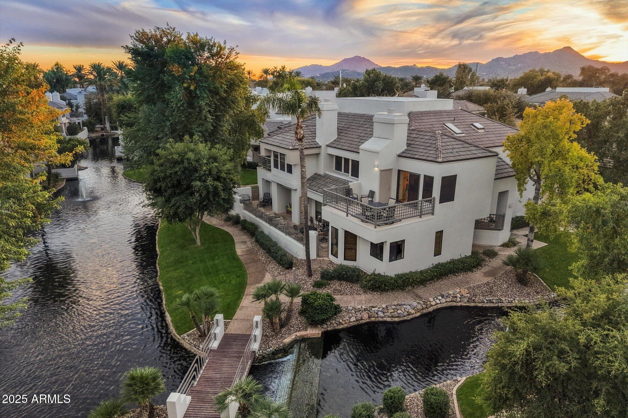 7272 East Gainey Ranch Road, Unit 104 Scottsdale, AZ 85258 - Photo 35 of 45 an aerial view of residential houses with outdoor space and swimming pool