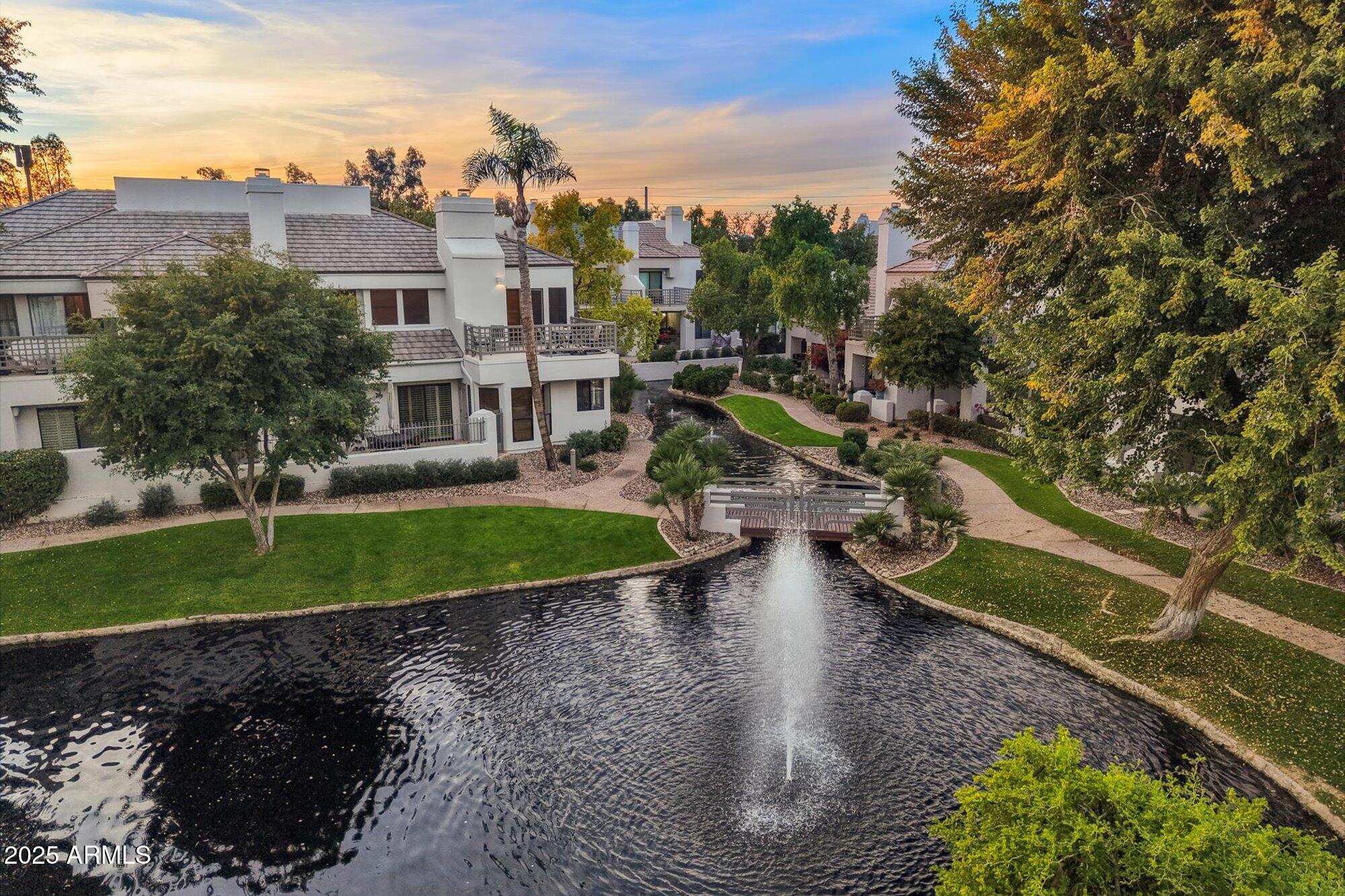 7272 East Gainey Ranch Road, Unit 104 Scottsdale, AZ 85258 - Photo 38 of 45 a view of a house with a yard