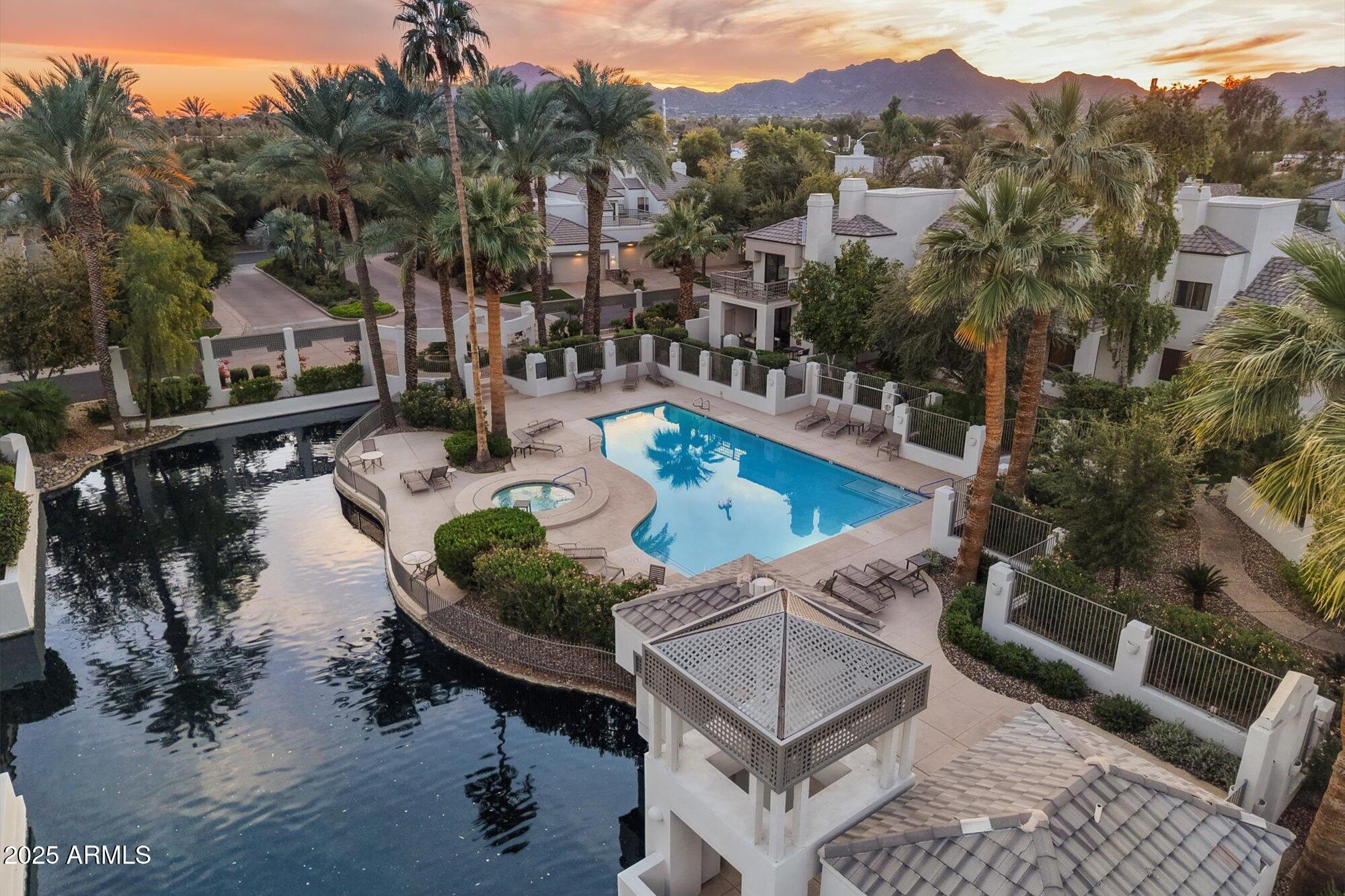 7272 East Gainey Ranch Road, Unit 104 Scottsdale, AZ 85258 - Photo 4 of 45 a view of a chairs and table in the terrace