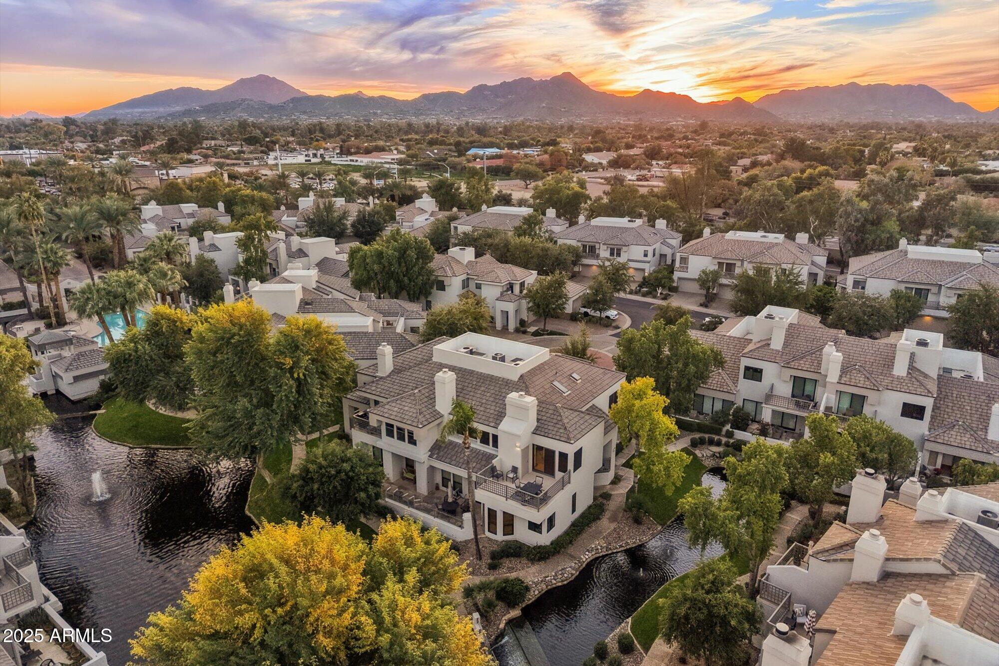 7272 East Gainey Ranch Road, Unit 104 Scottsdale, AZ 85258 - Photo 41 of 45 an aerial view of residential house with an outdoor space and seating