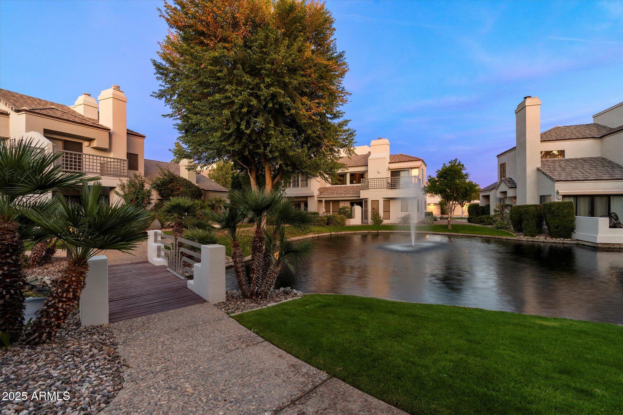 7272 East Gainey Ranch Road, Unit 104 Scottsdale, AZ 85258 - Photo 45 of 45 a view of swimming pool from a yard