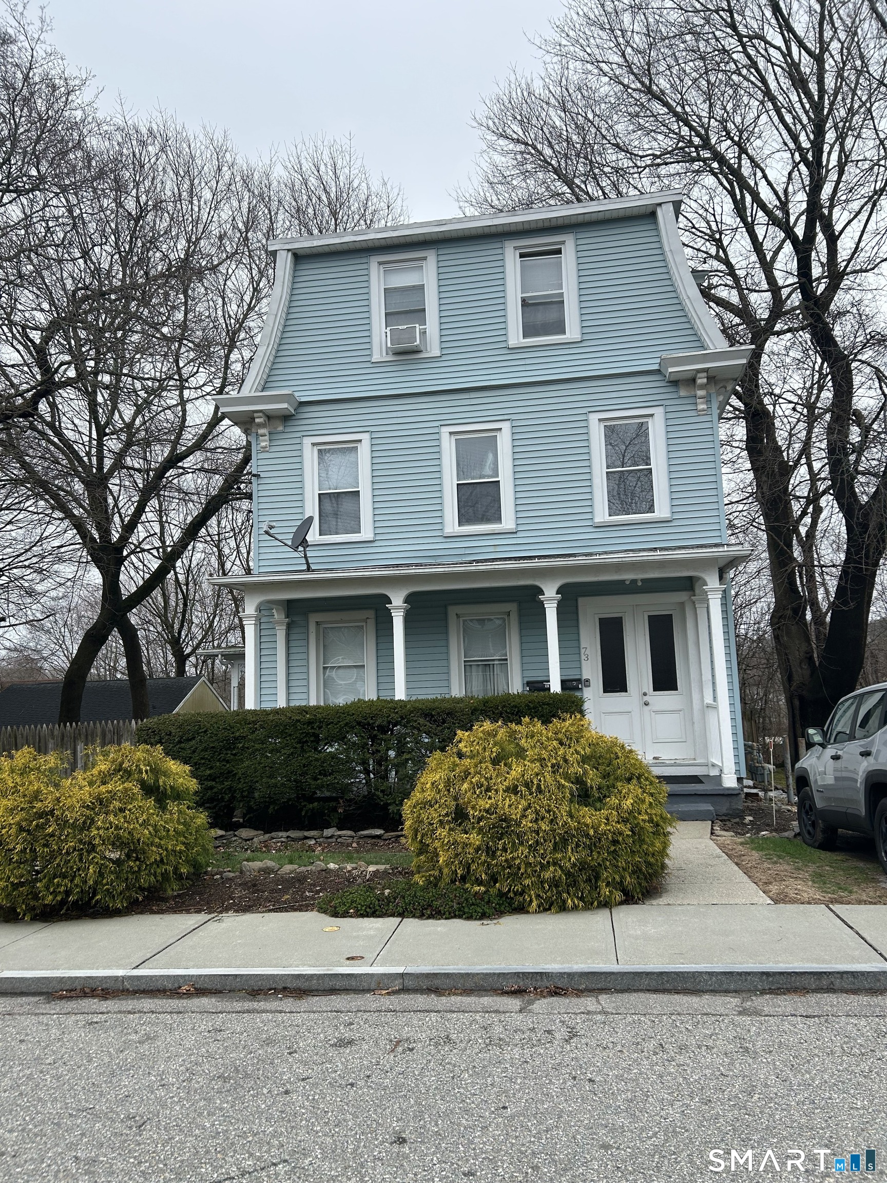 73 Peck Street, Unit 2 Norwich, CT 06360 - Photo 1 of 21 a front view of a house with a garden