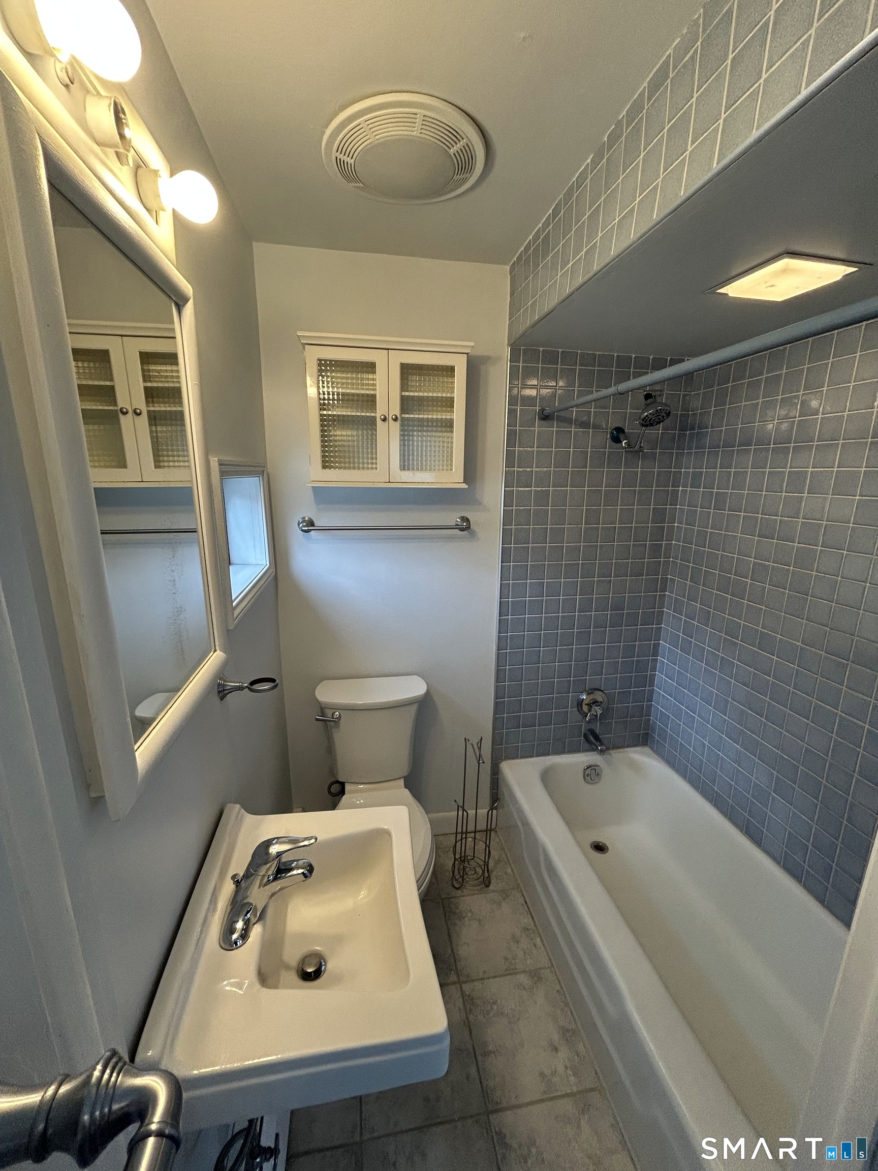 73 Peck Street, Unit 2 Norwich, CT 06360 - Photo 13 of 21 a bathroom with a sink and bathtub with shower