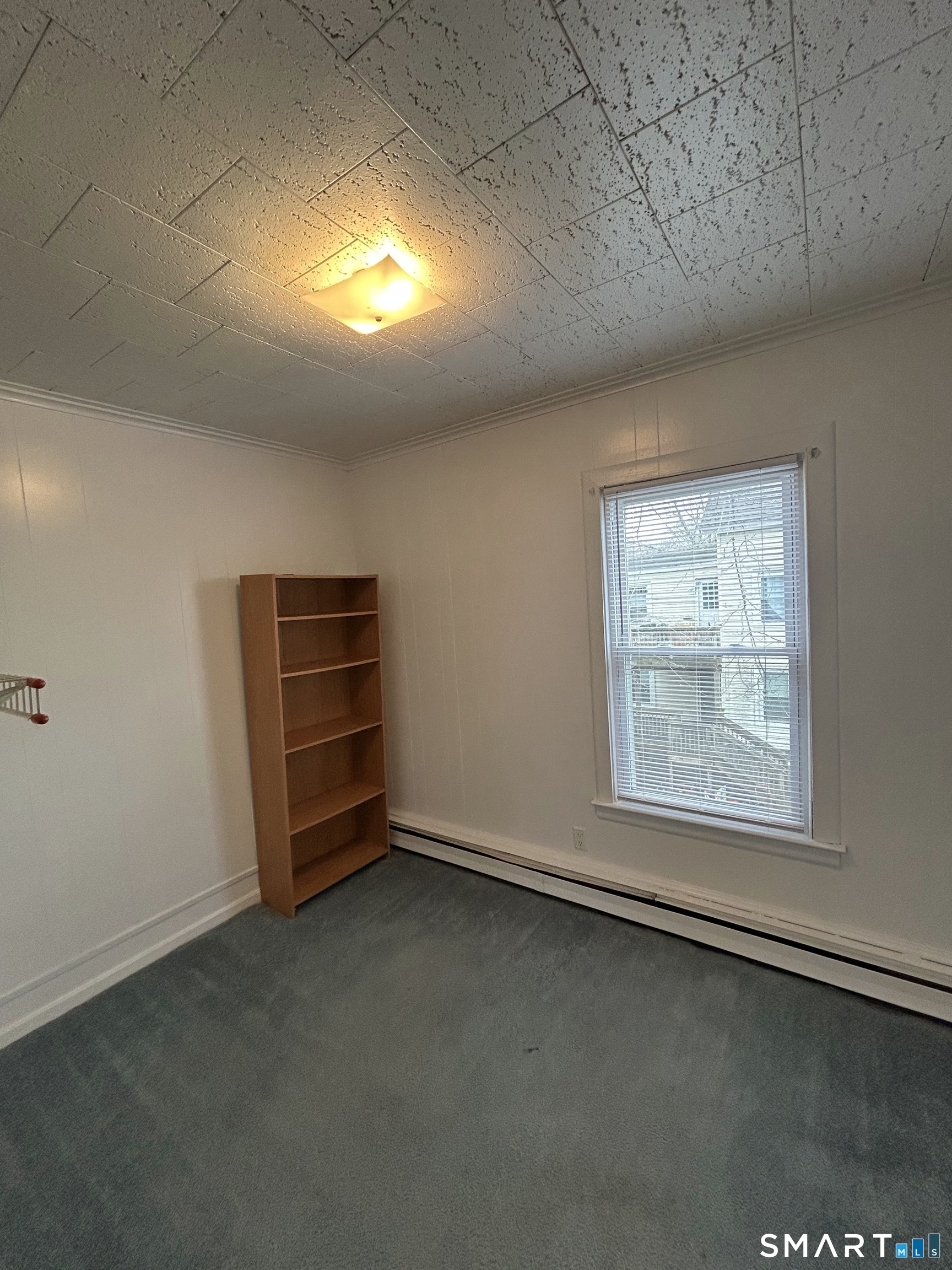 73 Peck Street, Unit 2 Norwich, CT 06360 - Photo 17 of 21 an empty room with a empty space and windows