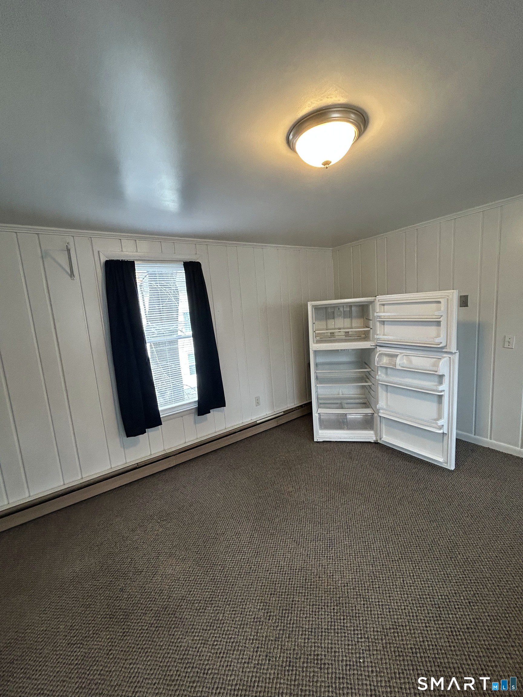 73 Peck Street, Unit 2 Norwich, CT 06360 - Photo 7 of 21 a view of room and front door
