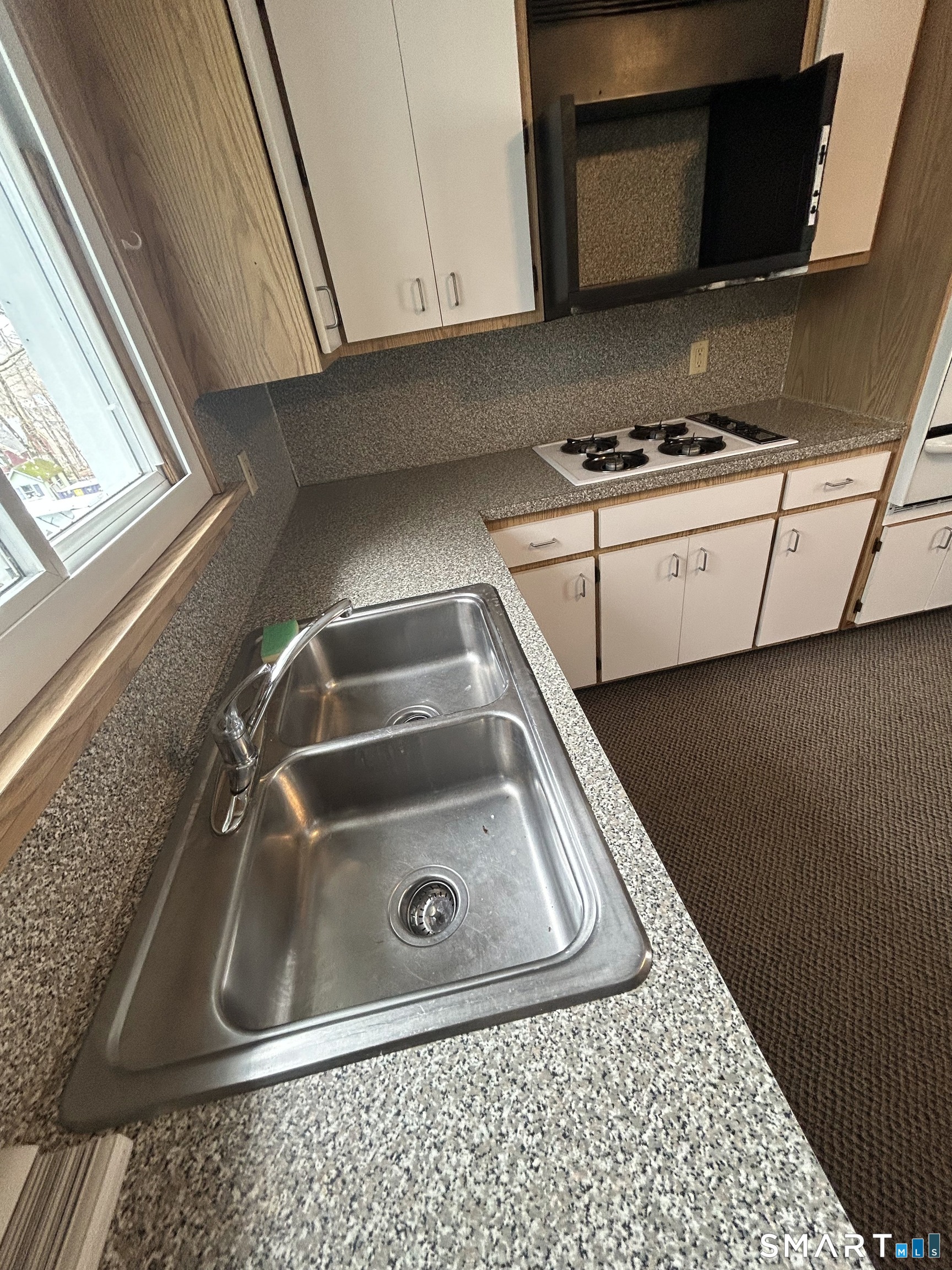 73 Peck Street, Unit 2 Norwich, CT 06360 - Photo 8 of 21 a close view of sink and washing machine