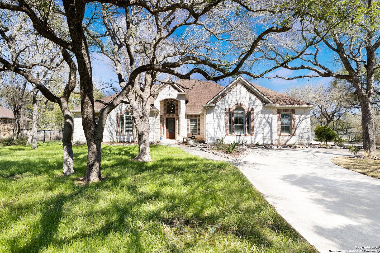 436 Hidden Springs Spring Branch, TX 78070 - Photo 1 of 55 a front view of house with yard and green space