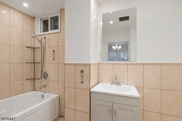 a bathroom with a bathtub and a sink
