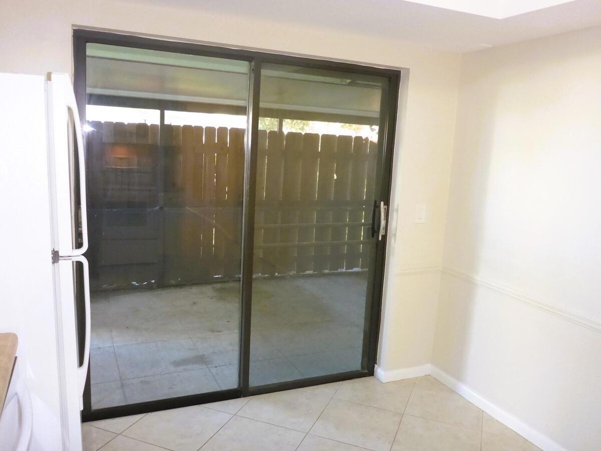 431 Jupiter Lakes Boulevard, Unit 2109A Jupiter, FL 33458 - Photo 11 of 23 a bathroom with a glass shower door