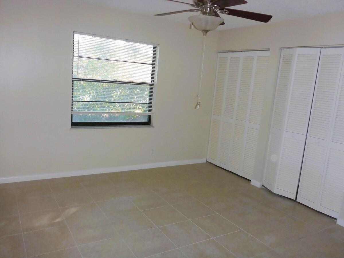 431 Jupiter Lakes Boulevard, Unit 2109A Jupiter, FL 33458 - Photo 18 of 23 an empty room with a window