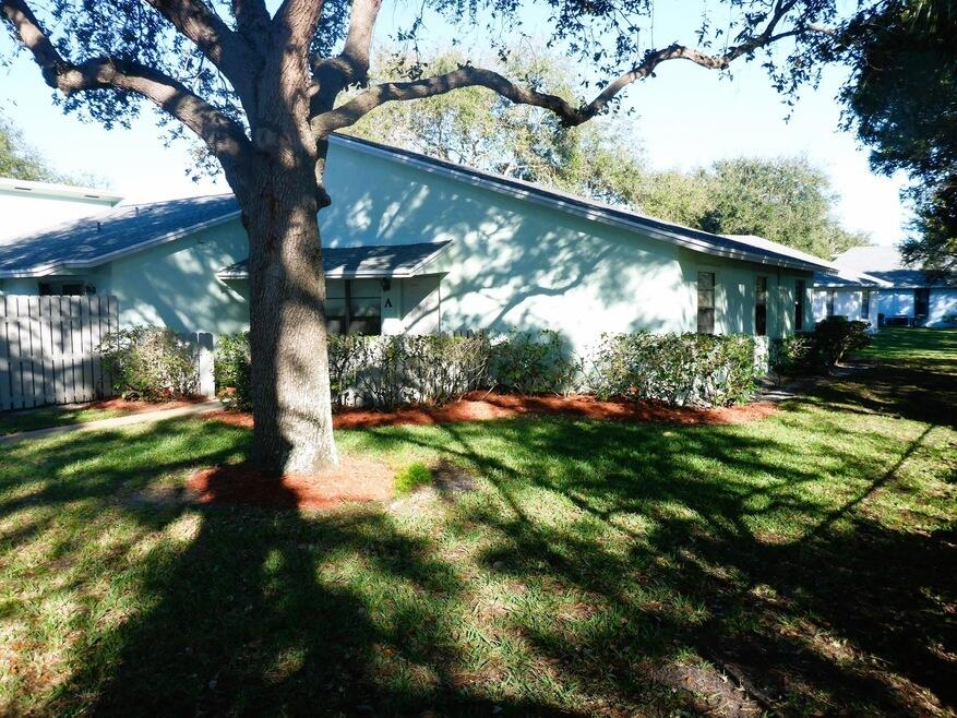 431 Jupiter Lakes Boulevard, Unit 2109A Jupiter, FL 33458 - Photo 3 of 23 a view of a yard in front of house