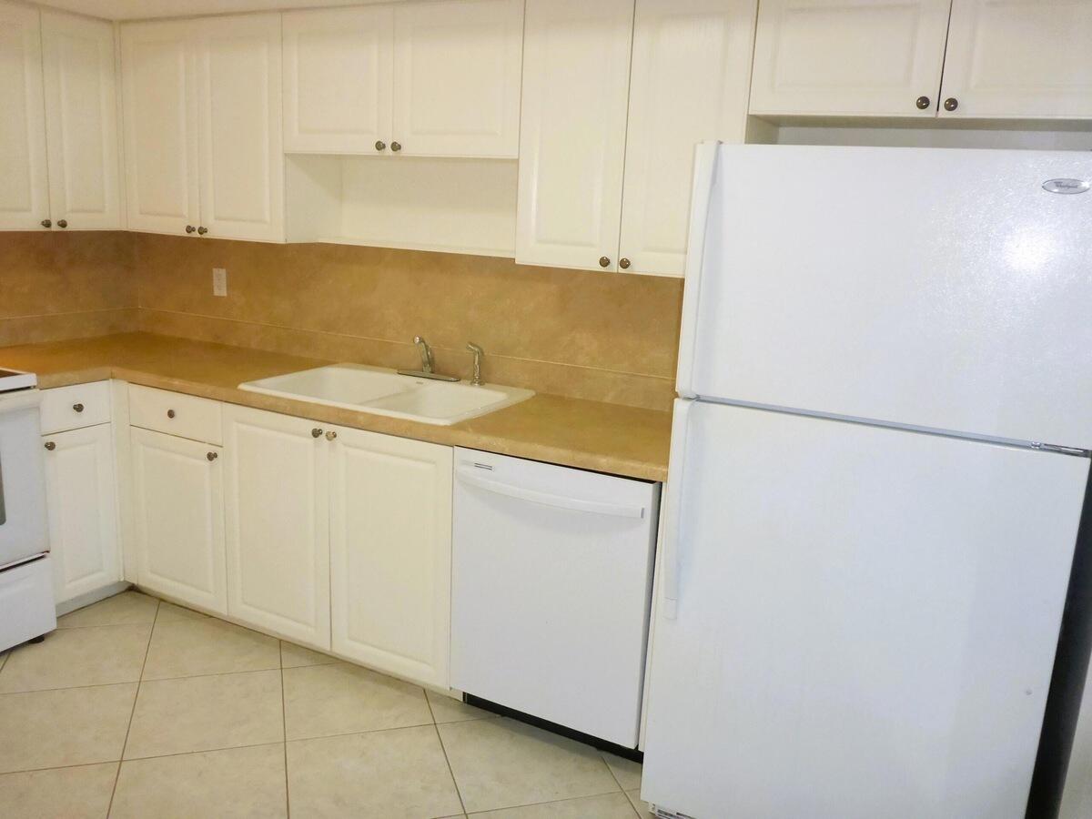 431 Jupiter Lakes Boulevard, Unit 2109A Jupiter, FL 33458 - Photo 10 of 23 a utility room with dryer and washer