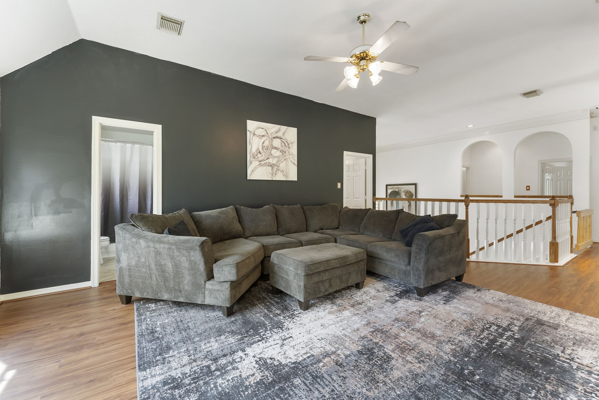 12907 Ryaneagles Circle Houston, TX 77044 - Photo 31 of 48 a living room with furniture and a chandelier