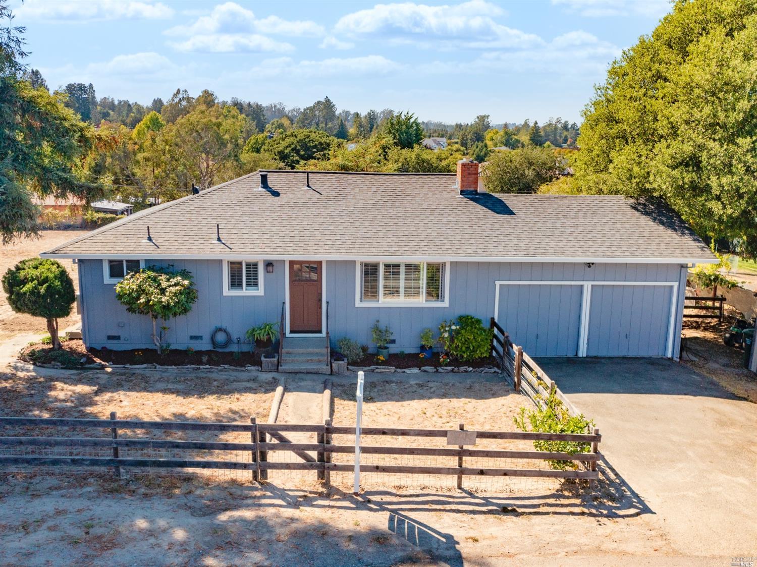 1706 Bloomfield Road Sebastopol, CA 95472 - Photo 1 of 1 a front view of a house with a yard