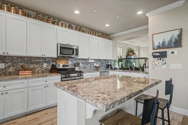 a living room with furniture or couch and a wooden floor