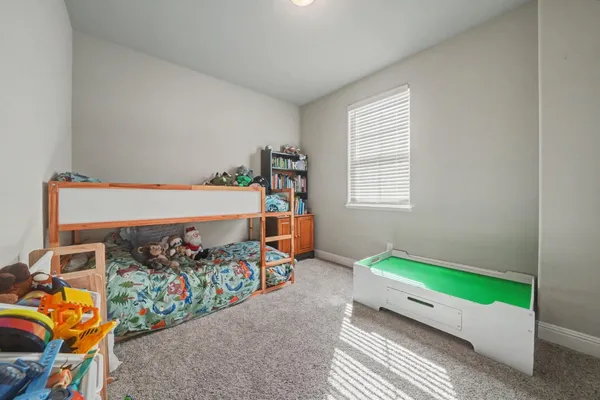 a view of a house with swimming pool and a chairs in a patio