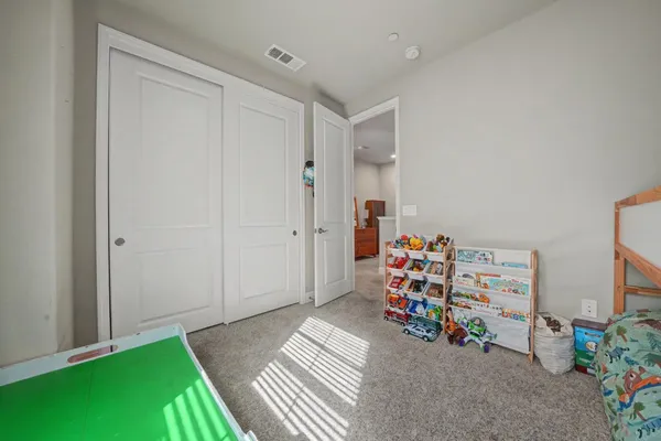 an aerial view of a house with a yard and lake view