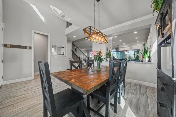 a view of a dining room with furniture window and wooden floor