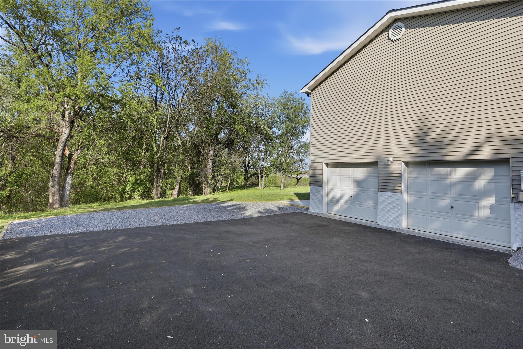 174 Open Field Lane Falling Waters, WV 25419 - Photo 39 of 56 Paved driveway w/ 2 car attached, side load garage