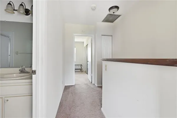 a bathroom with a sink and mirror